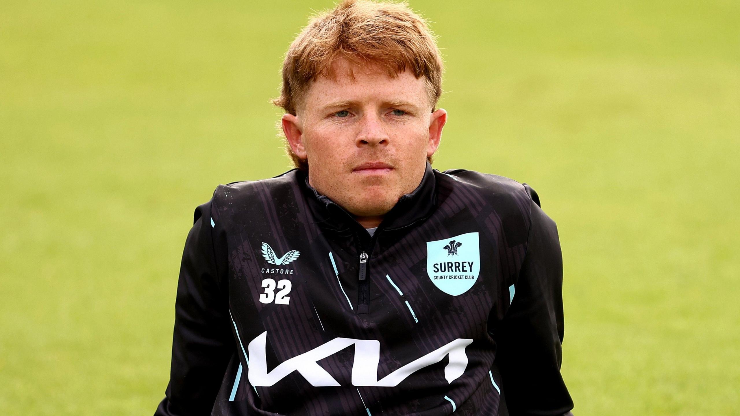Ollie Pope looks on