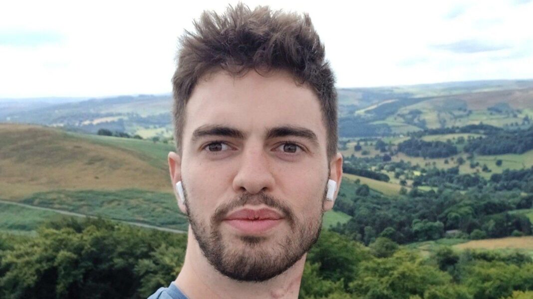 Family pays tribute to ‘warm and engaging’ man killed in tiger attack A selfie of William Chapman outdoors, with rolling hills, woodland and patchwork fields stretching across the landscape behind him. He is wearing wireless earbuds and is standing in front of a panoramic countryside view under a bright, cloudy sky.