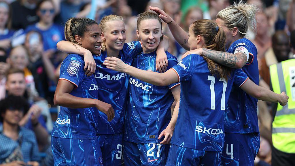 Chelsea players celebrate on the final day of last season
