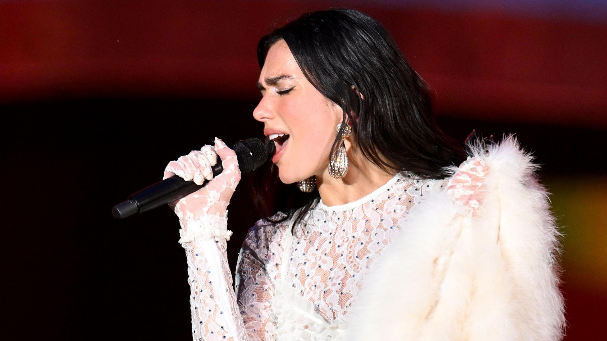 Dua Lipa sings during a concert at Wembley Stadium