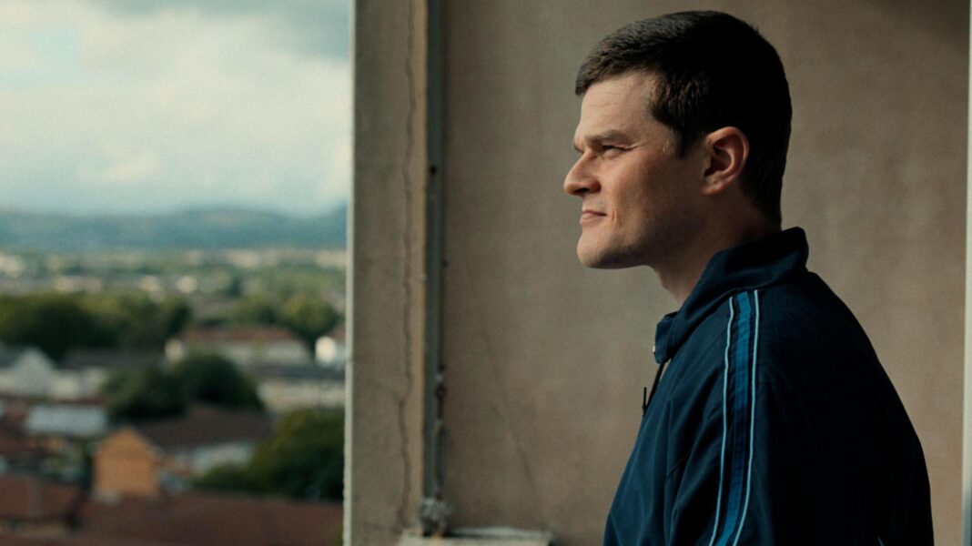 Tourette’s campaigner Davidson asks to watch Scottish Baftas via video link after racial slur row A photo from the film of the actor on the balcony of a high flat looking out