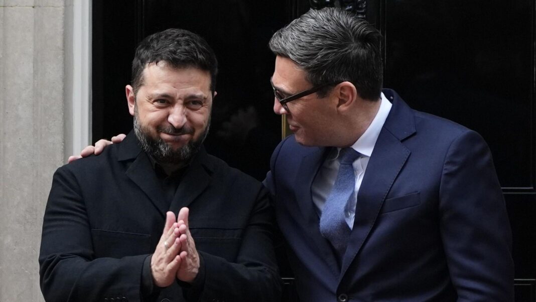 Burnham careful as he meets Zelensky but promises Ukraine won’t leave ’empty handed’ Volodymyr Zelensky smiling with his hands together standing next to Andy Burnham who has his arm around him.