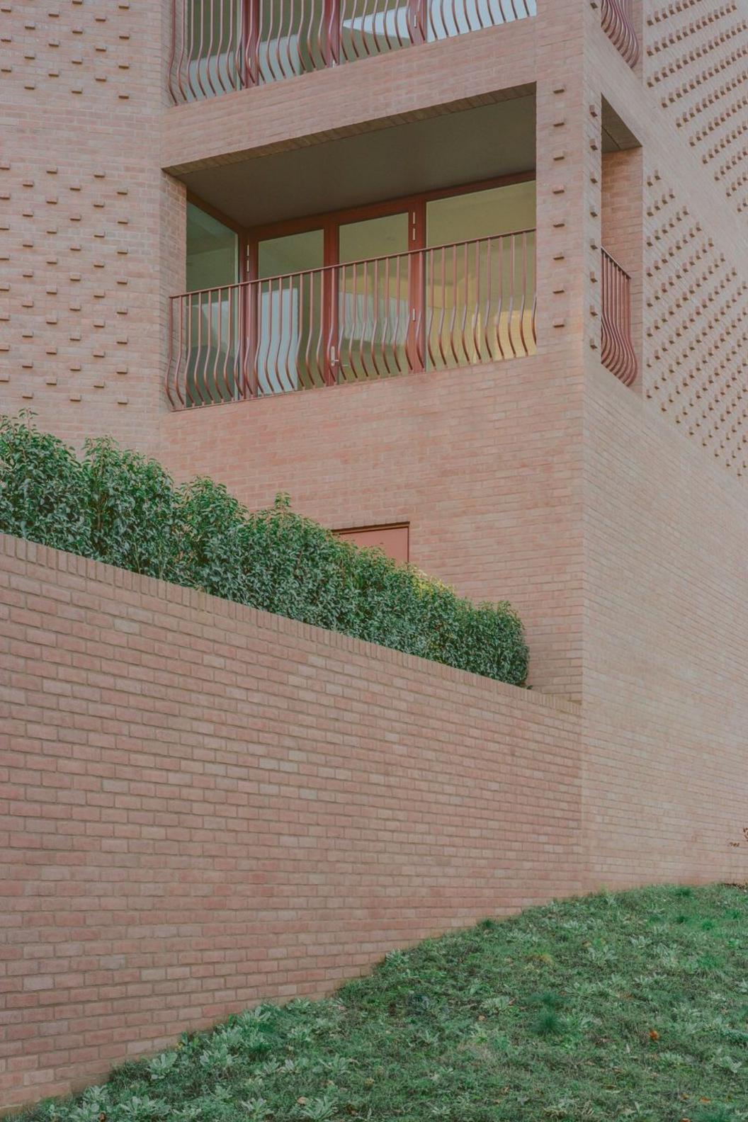 Low rise flats built with purple and pink brinks