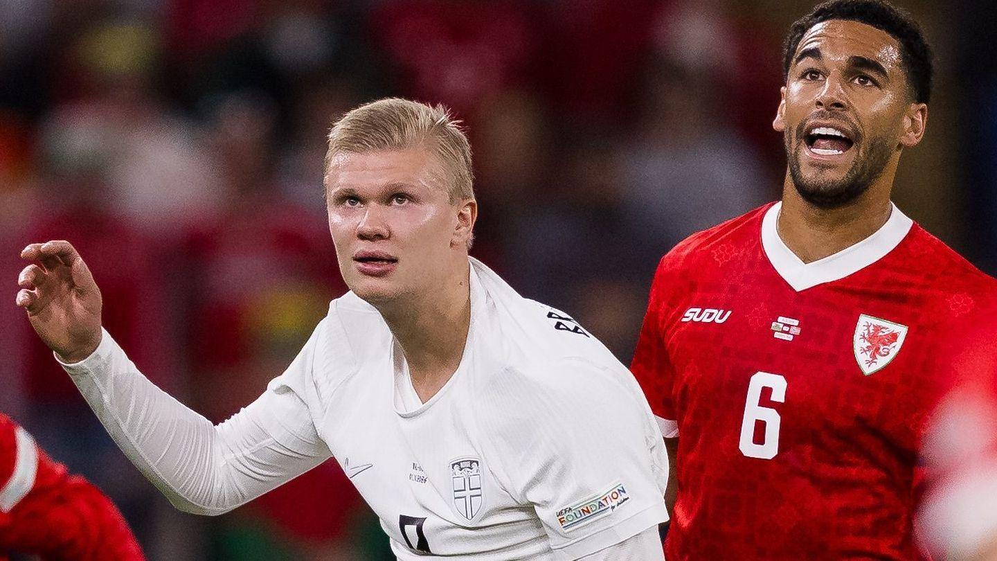 Ben Cabango (right) challenges for the ball with Erling Haaland