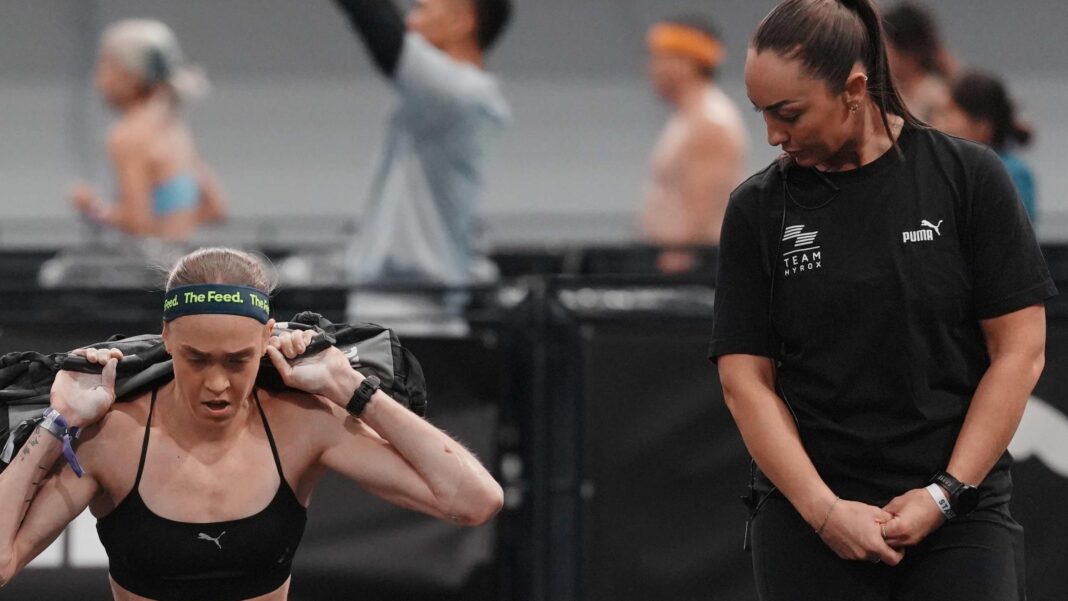 Hyrox athlete who soiled herself in race tells BBC she put others at risk but says backlash was traumatic Joanna Wietrzyk competing in Hyrox competition lifting a heavy bag as an official looks on.
