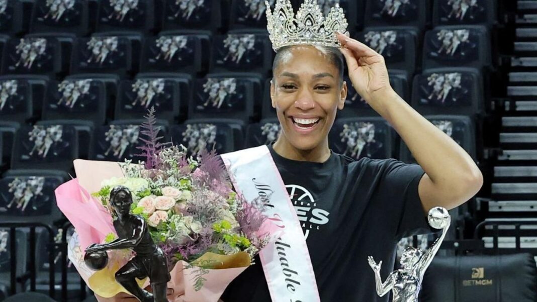 A'ja Wilson poses for photos with her fifth MVP trophy