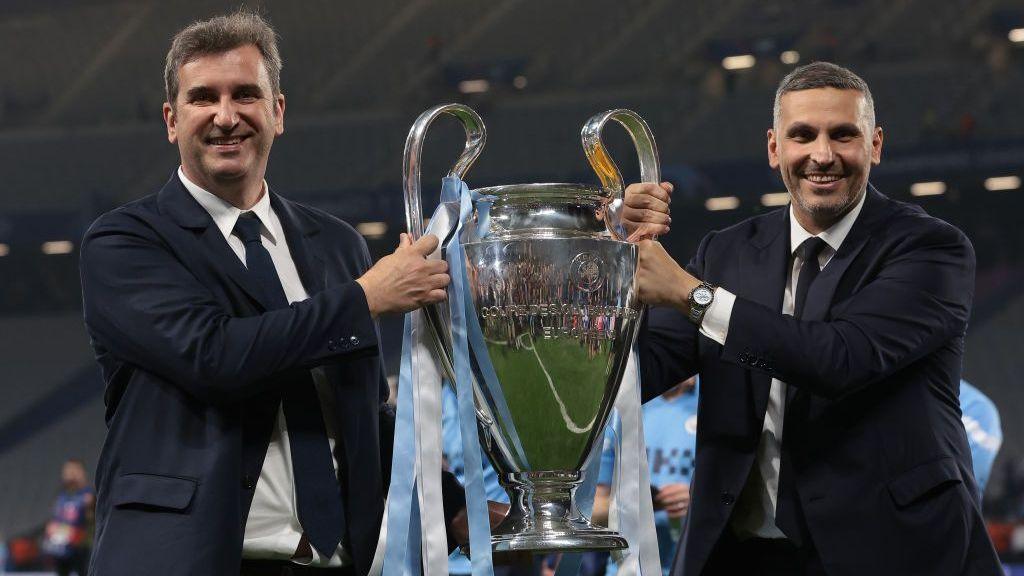 Ferran Soriano and Khaldoon Al Mubarak hold the Champions League trophy in 2023