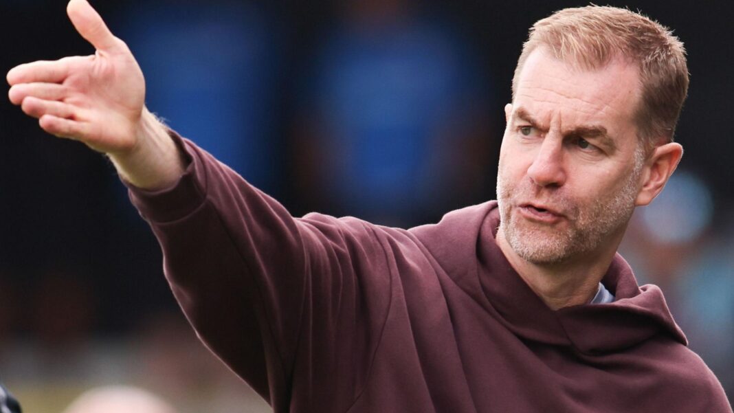 ‘I’m embarrassed’ – Harrogate boss after 3-0 defeat by nine-man Carlisle Harrogate Town boss Simon Weaver gesticulates wearing a purple hooded jumper
