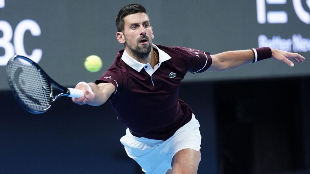 Novak Djokovic stretches to hit a forehand stroke during his quarter-final victory over Alexander Zverev