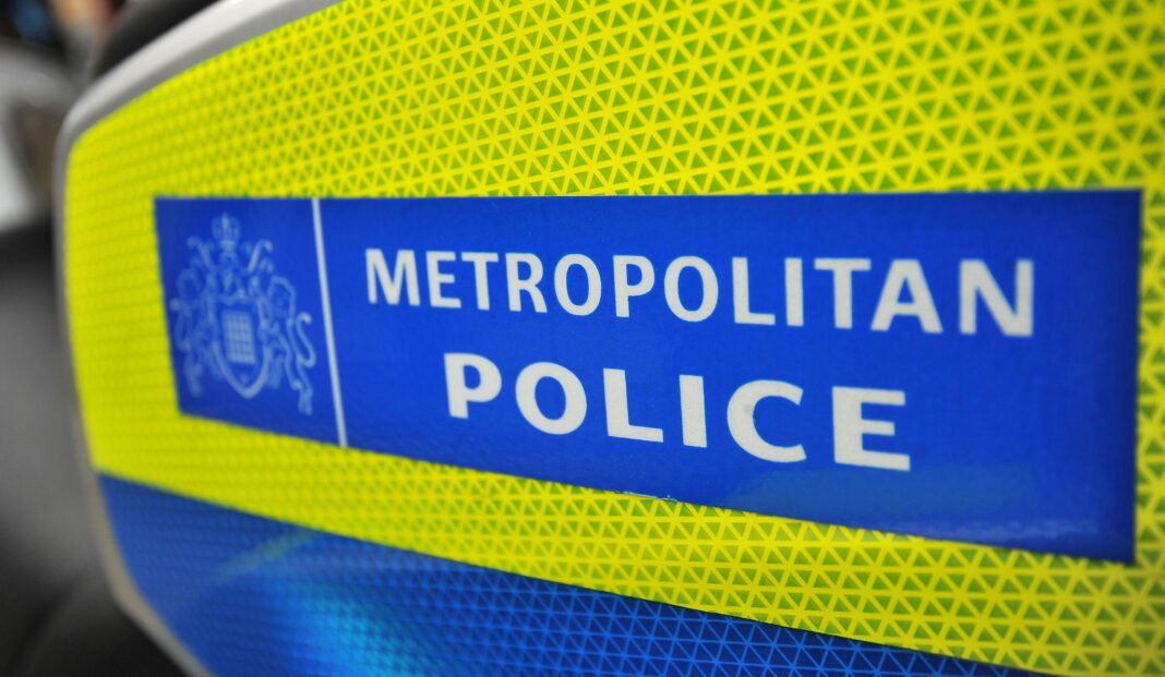 Met’s Special Constabulary head fired after AI tool found deleted intimate images on work phone Close-up image of the Metropolitan Police logo, which has white lettering on a blue background and yellow border.