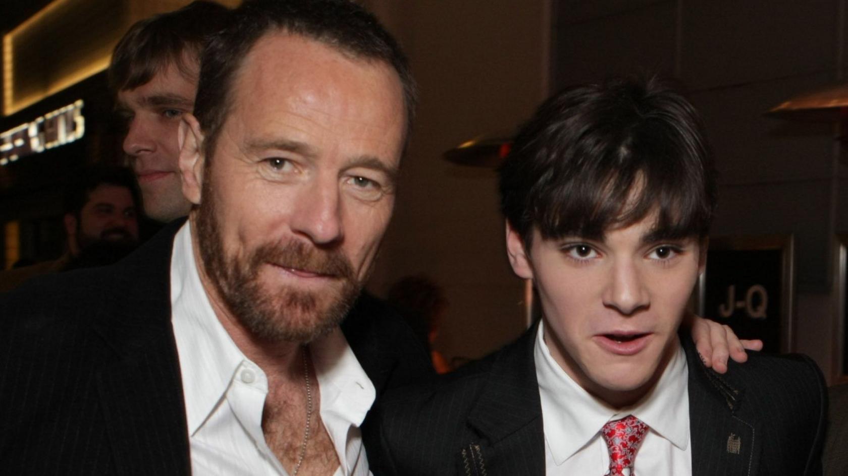 Bryan Cranston and RJ Mitte in white shirts and dark suits in 2008 at the premiere of Breaking Bad