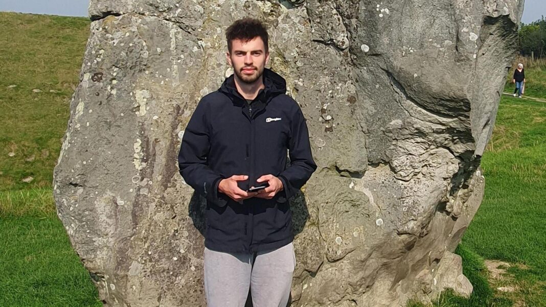 Man killed in tiger attack identified as William Chapman A man with dark hair and dark facial hair stood in front of a stone
