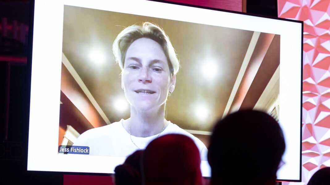 Jess Fishlock in white on a video screen in front of audience at the Welsh SPorts Hall of Fame Awards