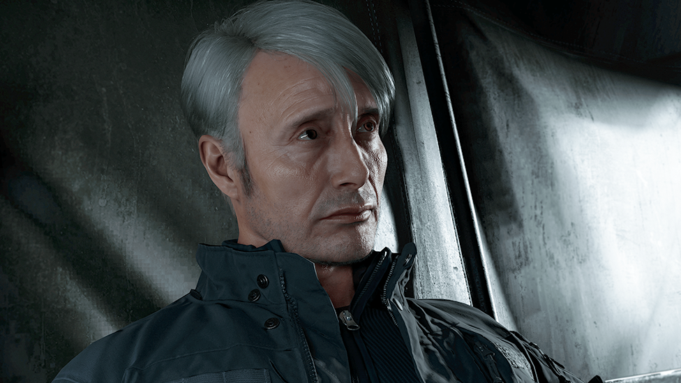 A still from Modern Warfare 4 showing a greying male character wearing a dark zip-up jacket. He's pictured looking solemn in a tent.