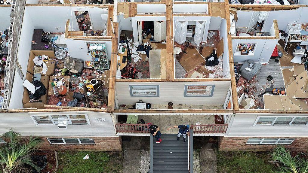 An apartment complex is seen from above, after the roof was blown off in Milton, Florida
