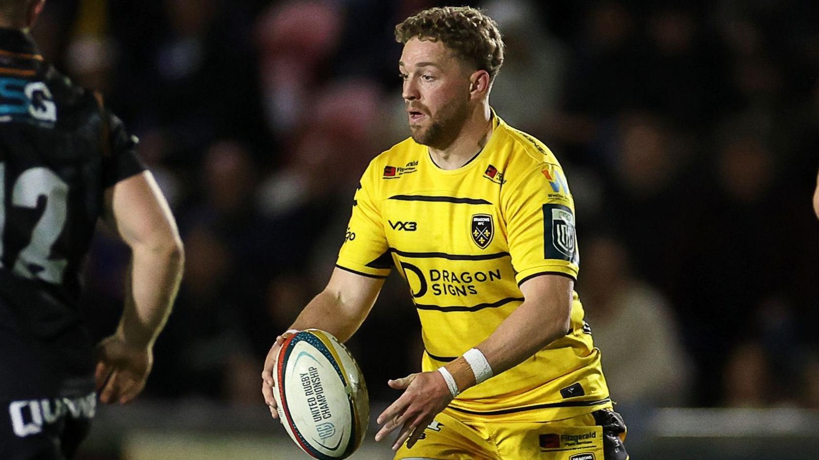 Angus O'Brien with the ball in his hands for Dragons