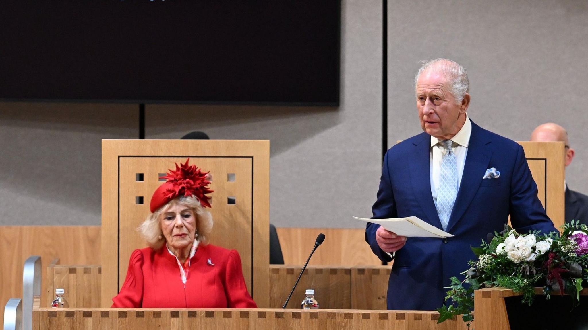 The King addressing the Senedd with Queen Camilla seated to his right.
