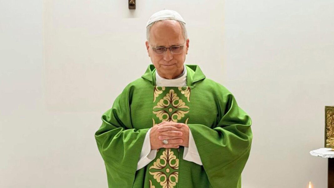 Pope pictured for first time since surgery as he says Mass at makeshift altar in hospital Pope Leo celebrates mass from hospital, wearing a green robe and standing before a white wall adorned with a wooden crucifix.