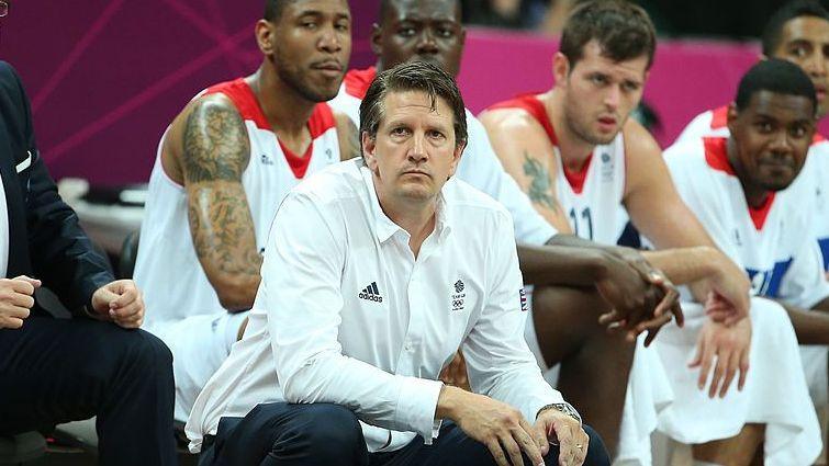 Chris Finch in a white shirt in front of GB players on the bench at the London 2012 Games