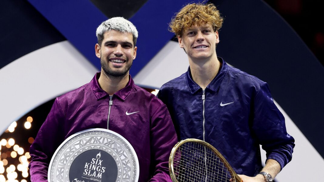 Carlos Alcaraz and Jannik Sinner pose with their prizes at the 2025 Six Kings Slams