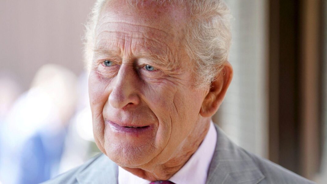 King’s Caribbean tour will not shy away from ‘darkest days of our past’ King Charles III wearing a pink shirt and light grey suit. He has receding white hair.