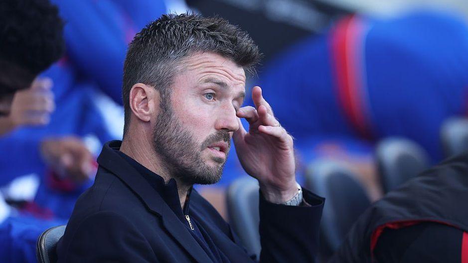 Michael Carrick touching his face