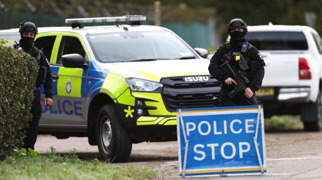UK-Iranian dual national arrested over RAF Fairford incident, police say An armed police officer stands guards on a road outside the perimeter of the RAF Fairford airbase