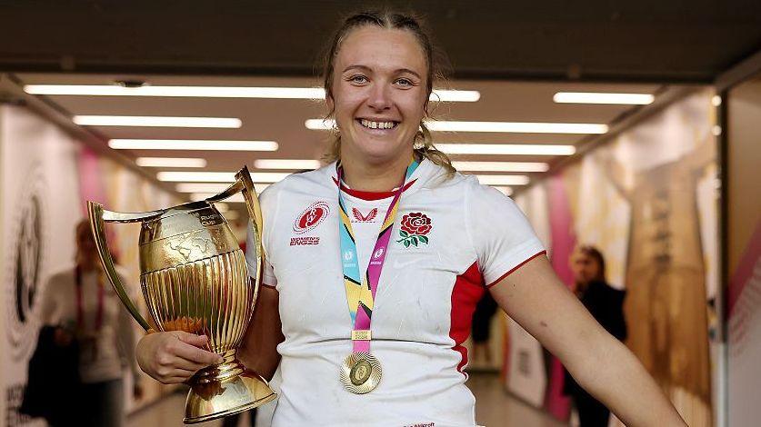 England's Zoe Stratford celebrates with the World Cup trophy