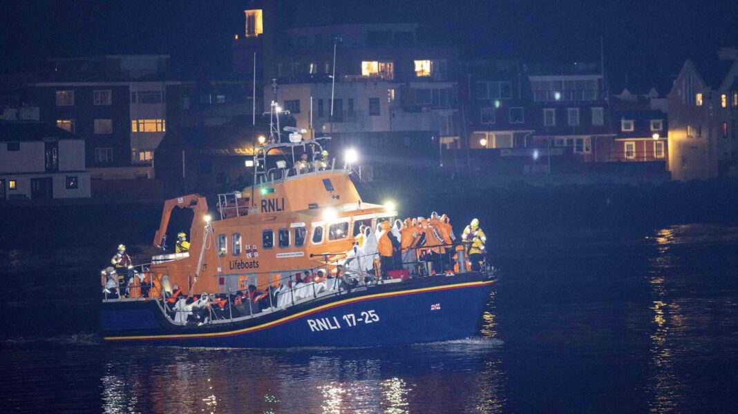 Protesters gather as migrants brought ashore on south coast The migrants were brought into Gosport on board an RNLI boat