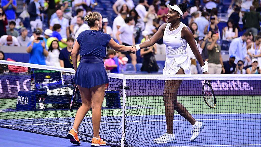 Sofia Kenin shakes hands with Venus Williams after winning their 2026 US Open first round match at Arthur Ashe Stadium in Flushing Meadows, New York City