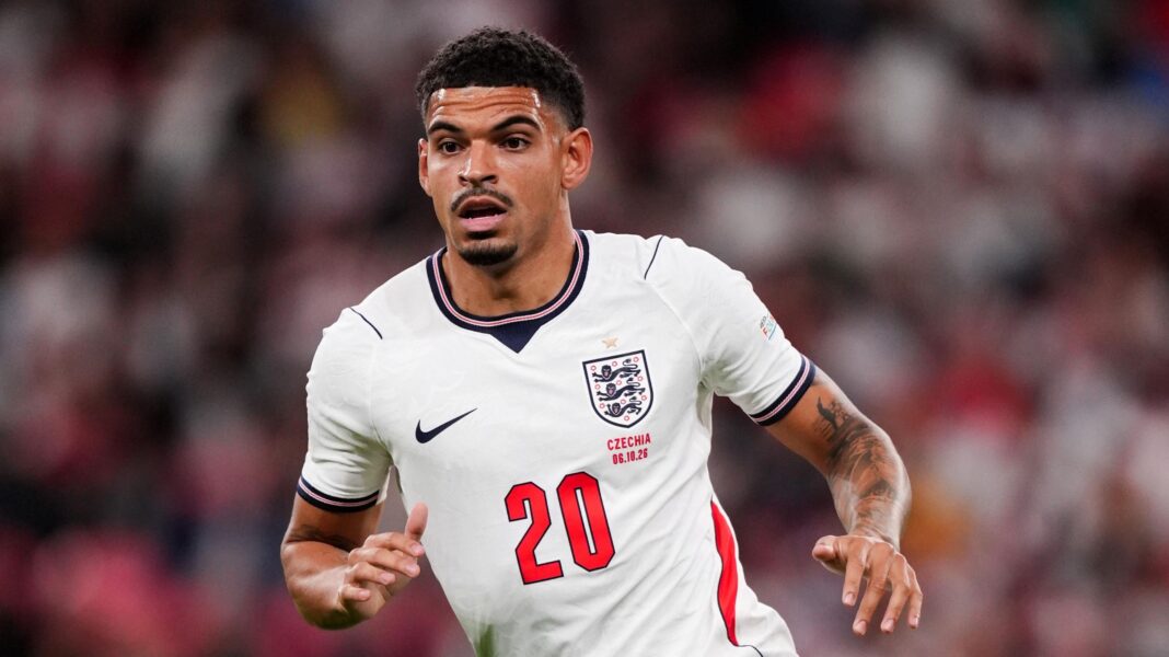 Morgan Gibbs-White wearing a white England kit