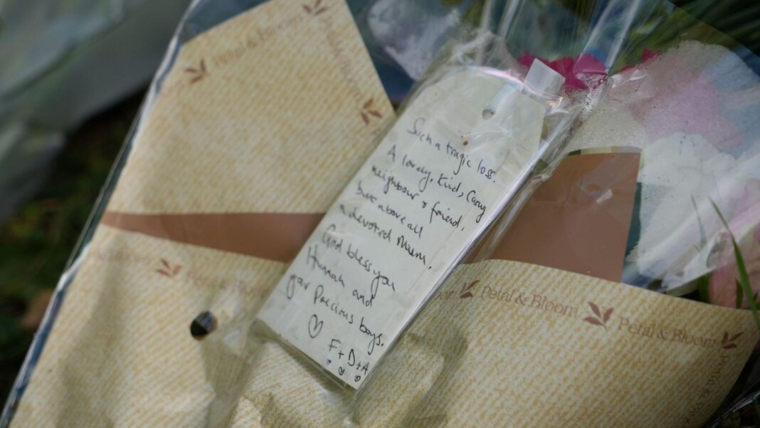 A bouquet of flowers with a note on it that reads: 