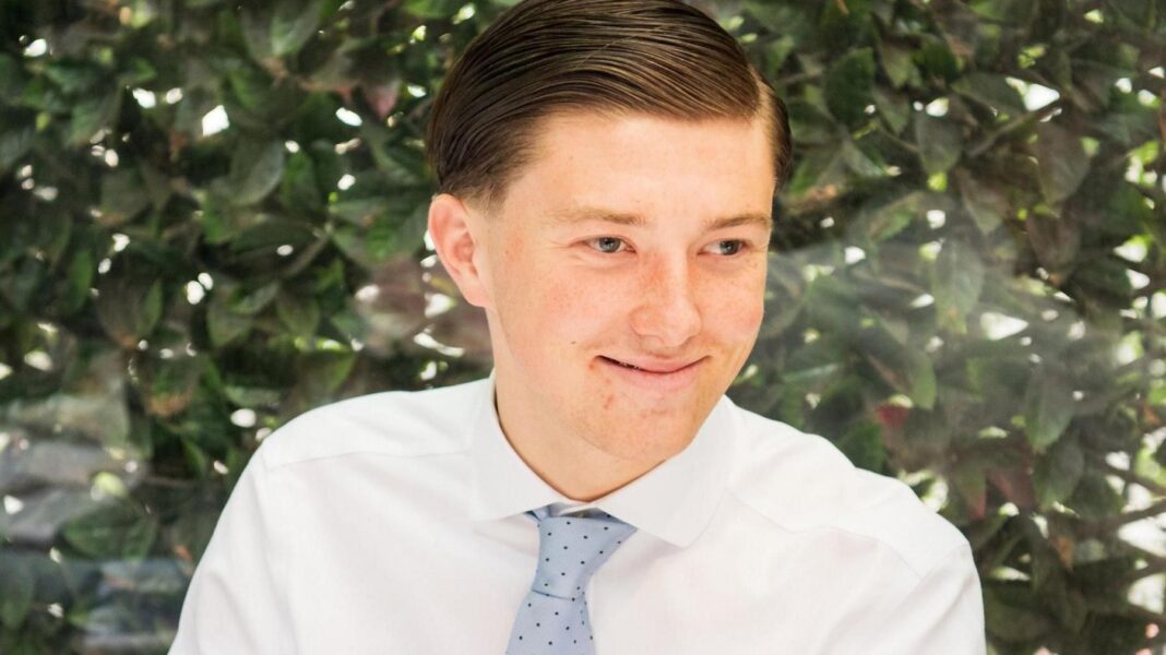 Mother of Henry Nowak killer could be deported A young man smiling wearing a white shirt and a blue tie. He is sitting in front of a green bush. He has brown hair.