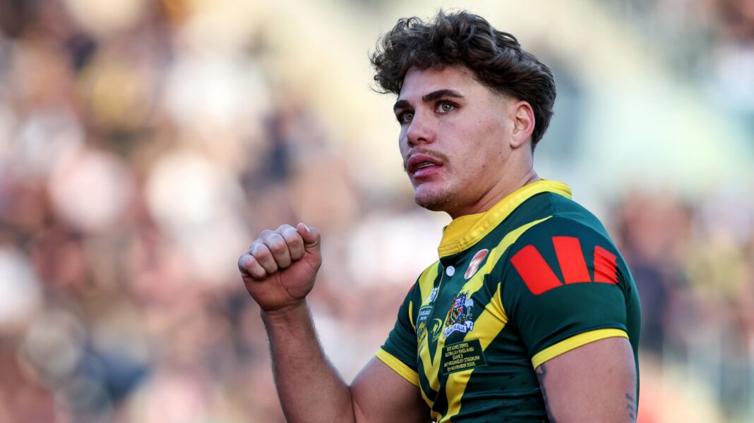 Connor out, Lewis in as England name World Cup squad Reece Walsh, wearing an Australia jersey, raises his right fist