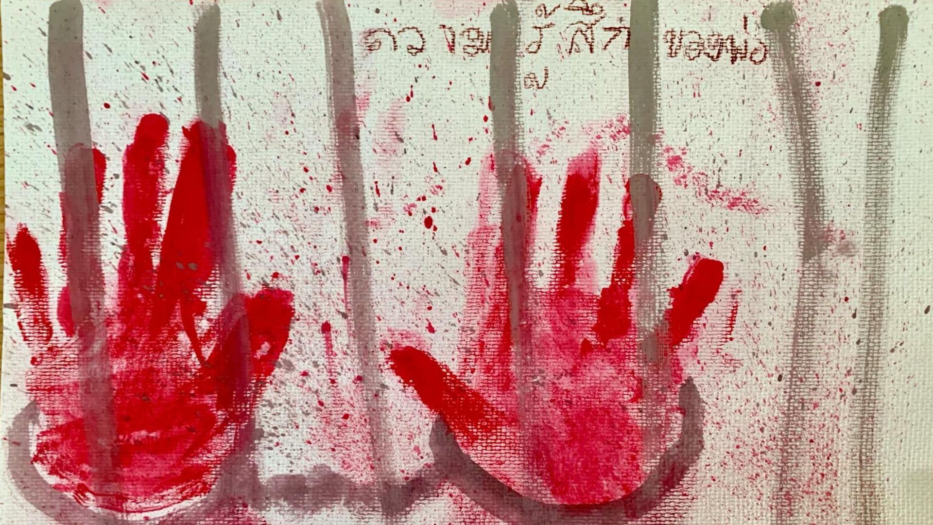 A painting of a pair of handcuffed hands on prison bars by Arnon's daughter, with the words, "my dad's feelings" written above them, in Thai.