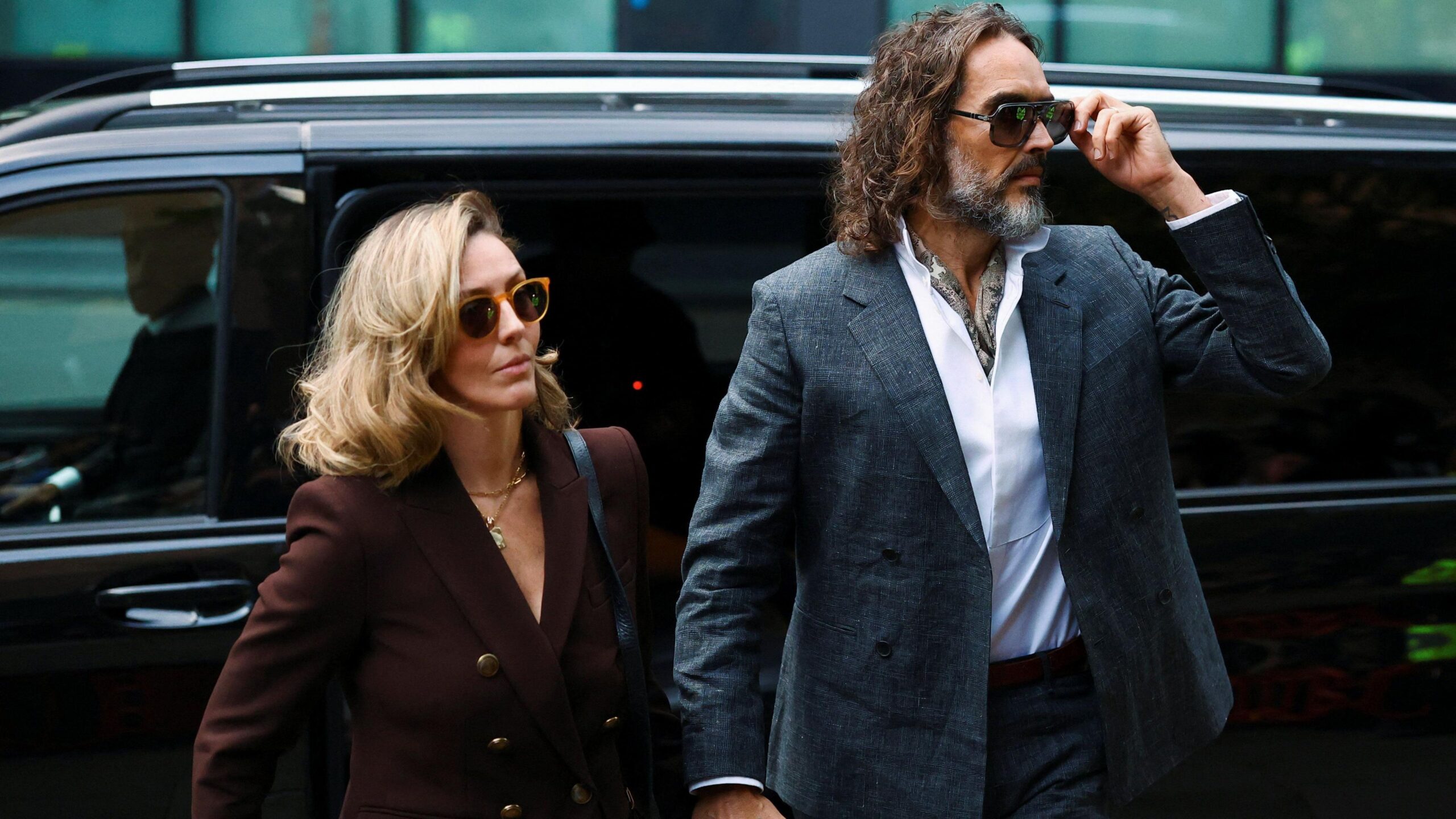 British actor and comedian Russell Brand and his wife Laura Brand arrive at Southwark Crown Court, where he is due to stand trial on charges of rape and sexual assault relating to six women, which he denies, in London, on 12 October 2026.