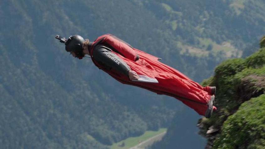 Man in wing suit flying through the sky. Picture taken from 2024 BBC Scotland documentary