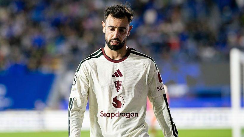 Bruno Fernandes looking dejected, while wearing a Manchester United away strip