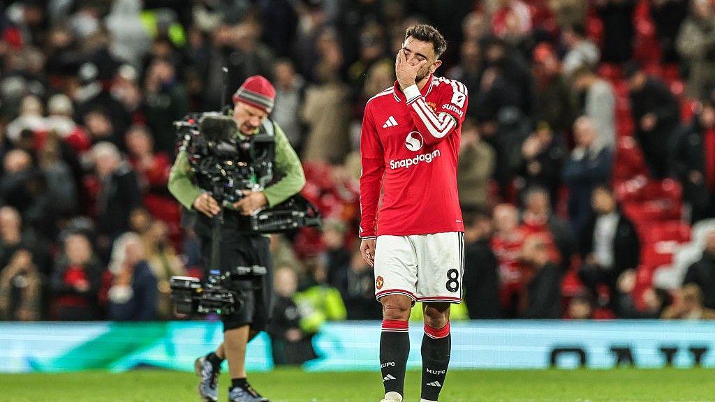 Manchester United skipper Bruno Fernandes rubbing his face after the 1-1 draw against Tottenham