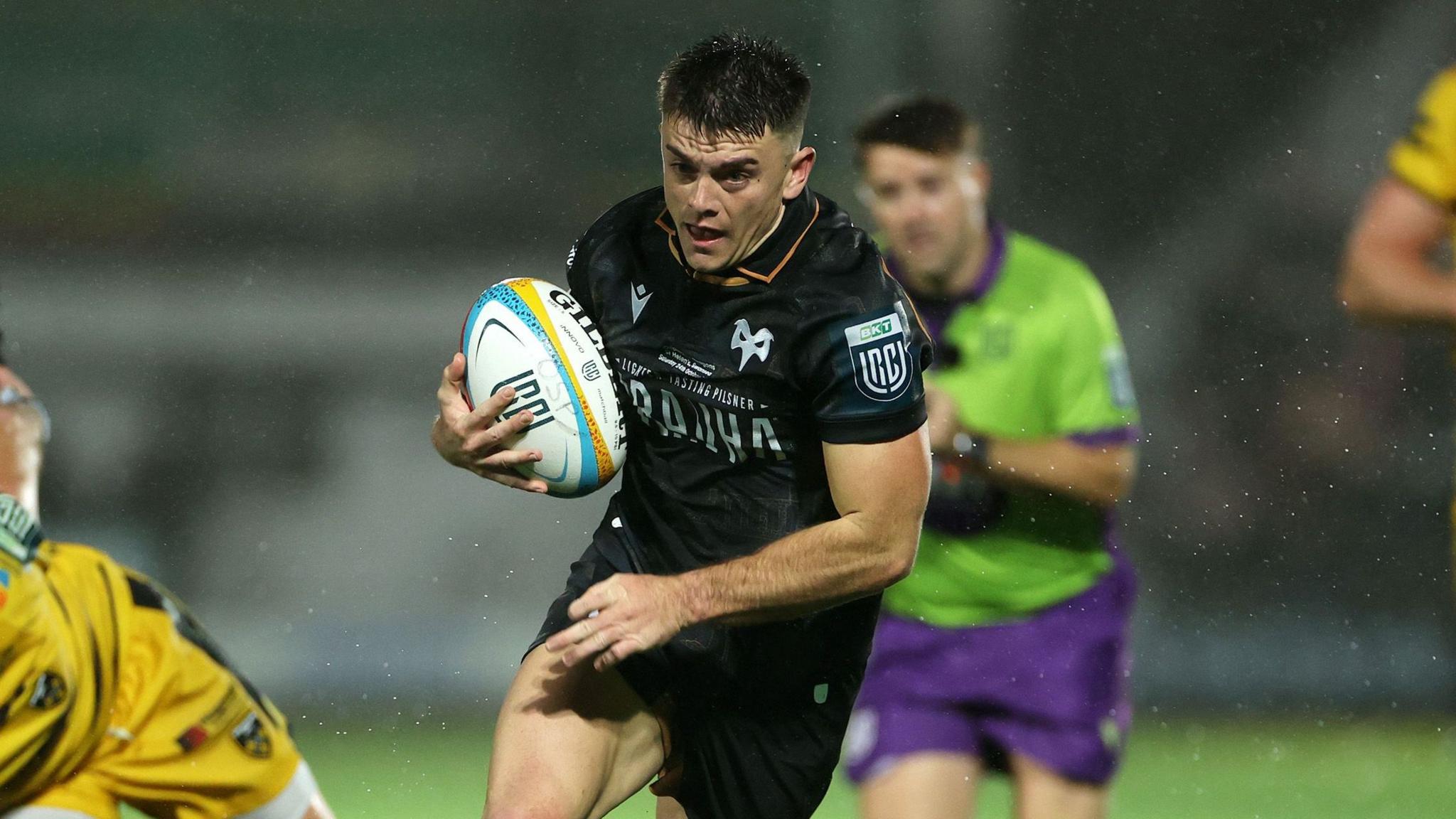 Reuben Morgan-Williams runs with the ball for Ospreys against Dragons