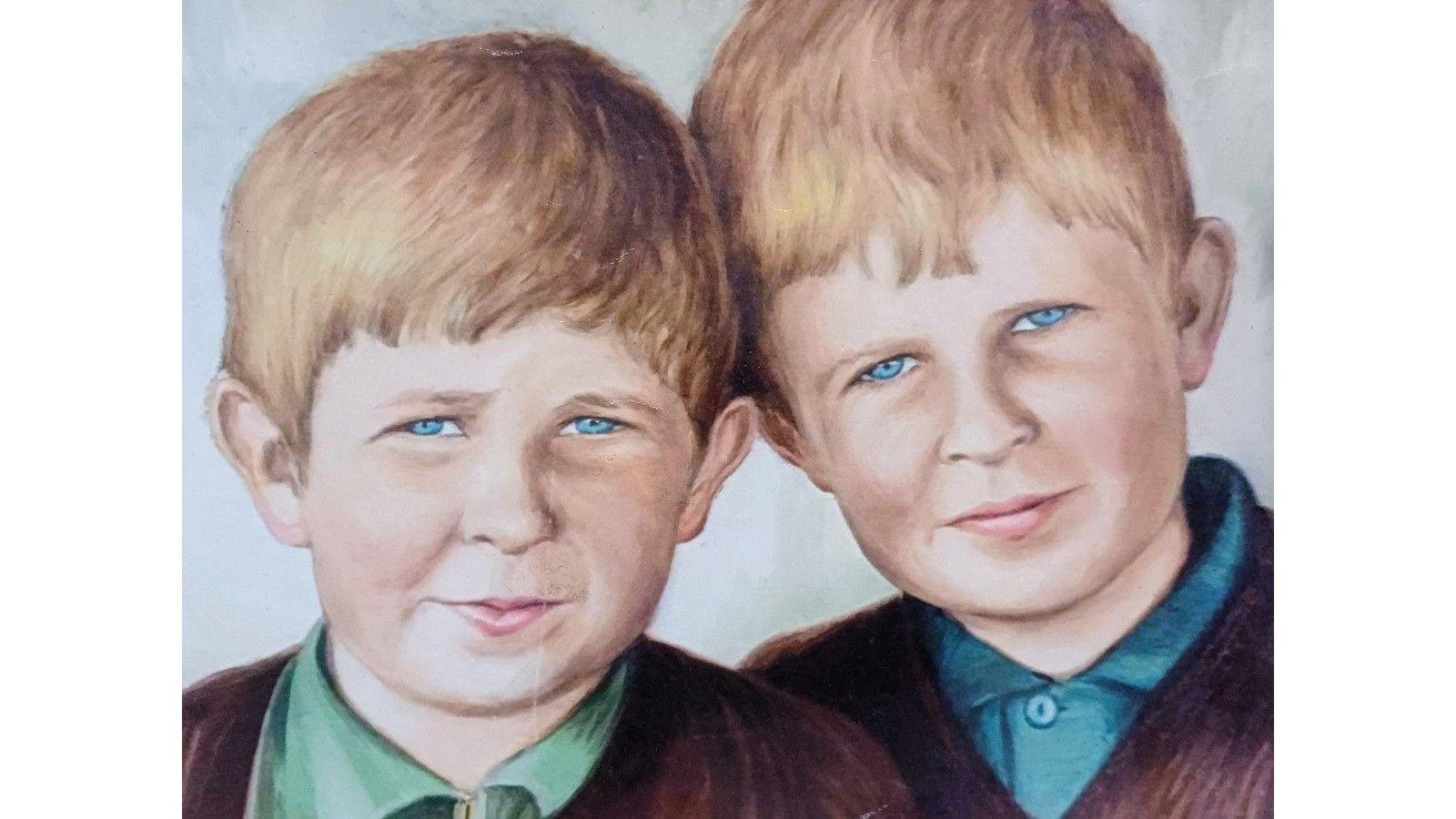 A portrait of two brothers with light brown hair and blue eyes
