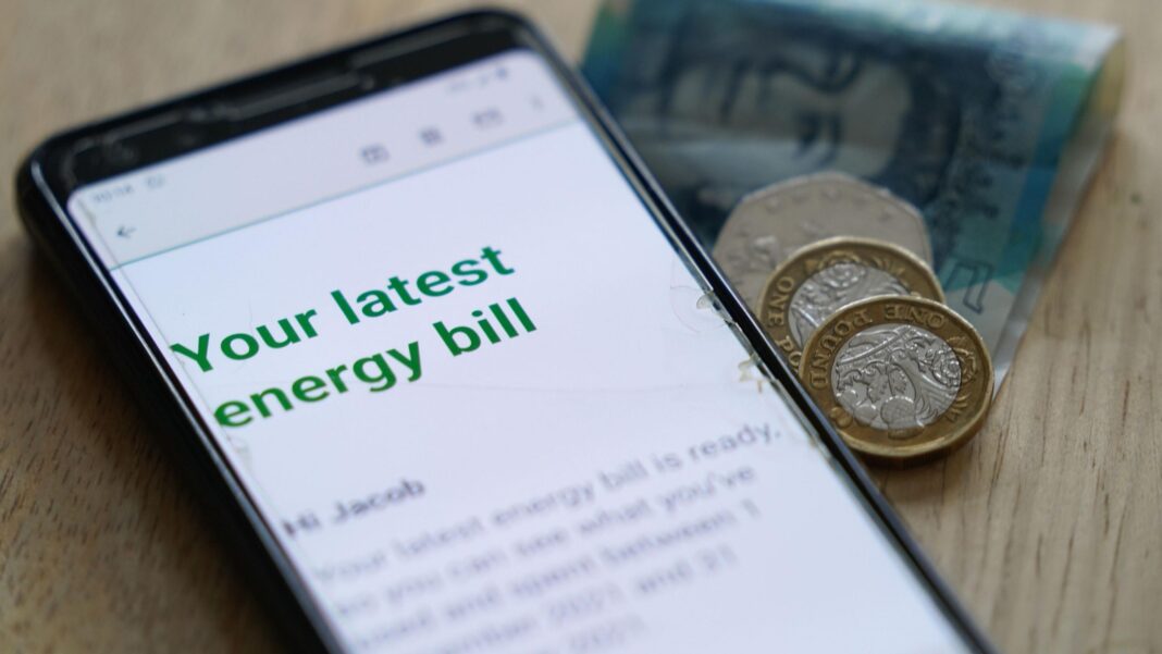 How much gas could Jackdaw provide? And will it cut your energy bills? Photo of an online energy bill on the screen of a mobile phone next to a folded five pound note, two pound coins and a 50p coin