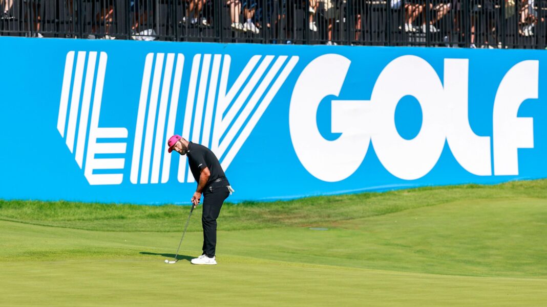LIV Golf secures potential $300m investment Jon Rahm playing a shot in front of a large banner saying LIV Golf