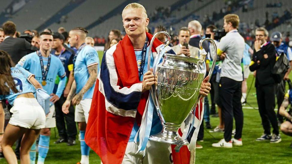 Erling Haaland of Manchester City celebrates the UEFA Champions league with the trophy