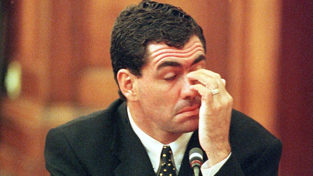 Sacked South African cricket captain Hansie Cronje wipes his eye during his cross-examination at the King Commission of Inquiry into allegations of cricket match-fixing in Cape Town 23 June 2000. Cronje later broke down and left the hearings in tears at the conclusion of his testimony