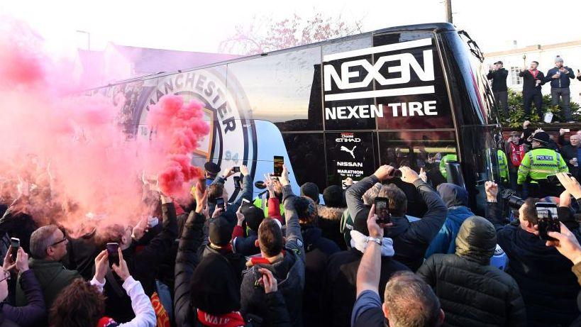 Manchester City will get a hostile reception when they face Liverpool at Anfield after being found guilty of breaching financial rules.