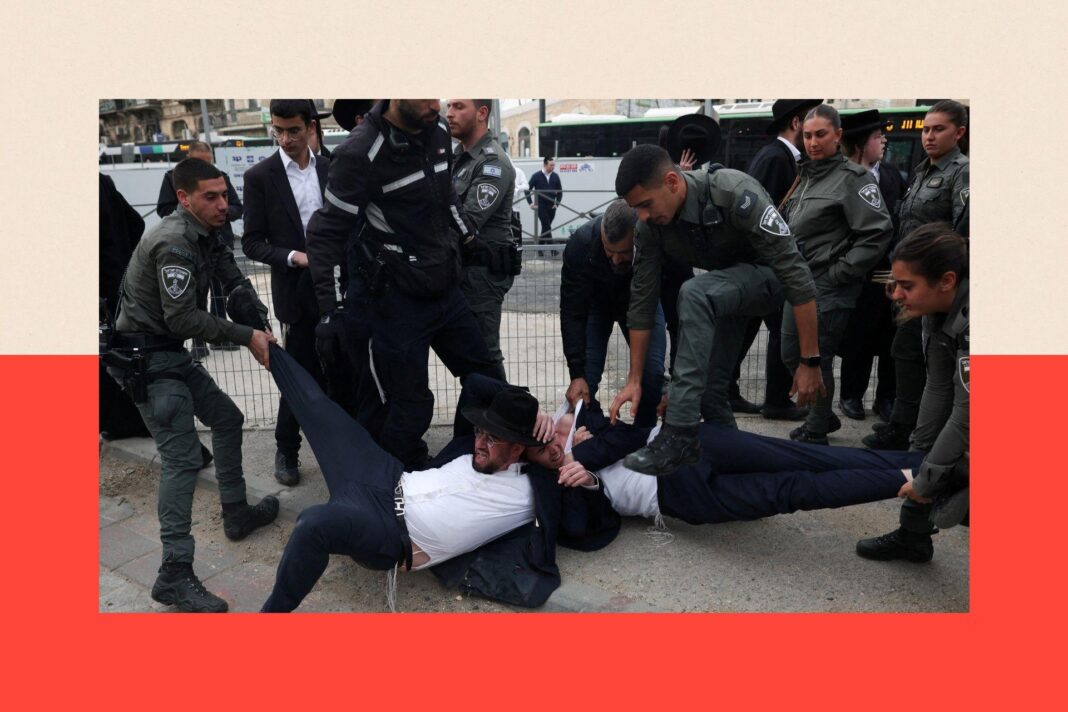 The bitter row over military service that could shape Israel’s future Two Haredi men are being removed by force by members of the Israel Border Force