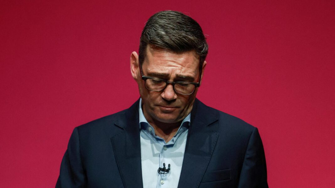 Chris Mason: Lib Dems rally behind Davey as he pledges change Andy Burnham during his speech to the Labour party conference. He is pictured against a red background, with his head hanging down.