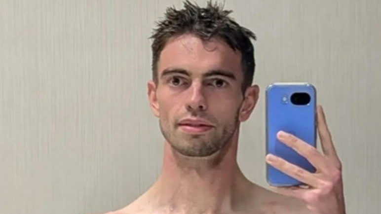 Selfie of a man holding up his phone.