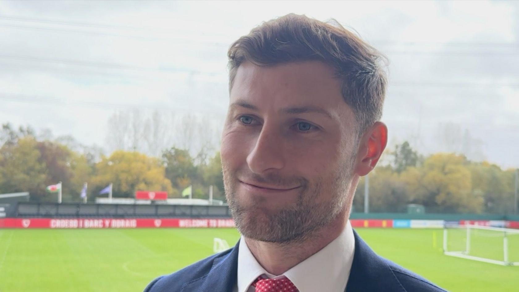 Ben Davies is pictured smiling at Dragon Park in Newport.